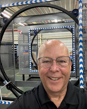 Tom Brizek, president, TAB Industries with TAB Wrapper Tornado orbital wrapper