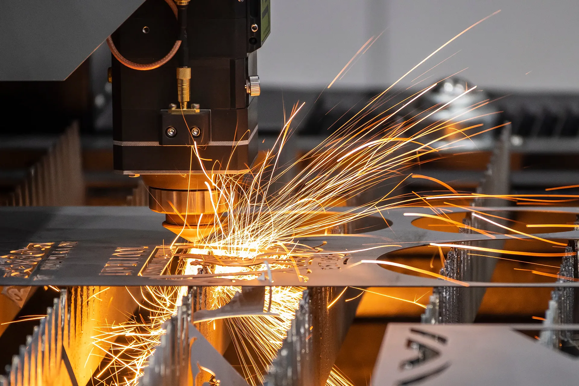 parts-fabrication-bg Andy Brizek using Laser Cutter at TAB Industries
